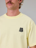 JUST ANOTHER FISHERMAN TIPPING THE SCALES SEA TEE - DAWN YELLOW
