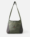 Green shoulder bag with a visible brand logo on a white background, PACKABLE 20 LITRES OF SPACE