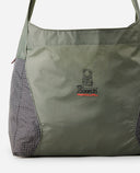 Green shoulder bag with a visible brand logo on a white background, PACKABLE 20 LITRES OF SPACE