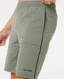 Green shorts with Rip Curl logo on a white background, 