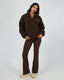 Person wearing All About Eve Amara Quarter Zip Teddy in brown with matching pants, showing cozy teddy texture and relaxed fit