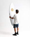 Person holding a white surfboard with a logo on a white background