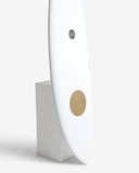 White cylindrical product with gold accents on a white background