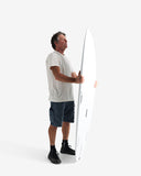 Man holding a long white object against a white background