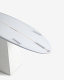 Close-up of a white surfboard with fins on a white background