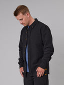 JAF Anchorage black linen-cotton shirt with button front and chest pocket shown in side profile on studio background