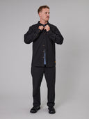 Just Another Fisherman Anchorage black linen-cotton shirt shown on model against grey background, buttoning collar
