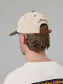 JUST ANOTHER FISHERMAN CASTING & MENDING CAP - IVORY/GREEN