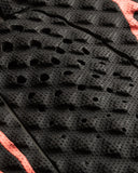 Close-up of black textured material with red accents