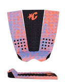 Colorful surfboard tail pad with a black center and orange logo on a white background