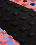Close-up of black textured foam mats with pink and purple border