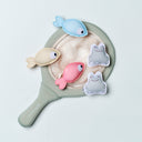 Children's paddle with fish-shaped stickers on a light gray background