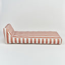 A striped outdoor daybed cushion set with alternating terracotta red and white horizontal stripes, shown from a side profile view on a clean white background.