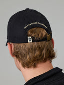 JUST ANOTHER FISHERMAN STAMP TILLER WAX CAP - BLACK